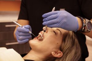 dentist with patient needing urgent care