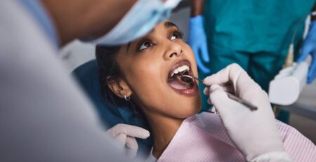 its time start smiling again shot young woman having dental work done her teeth ()